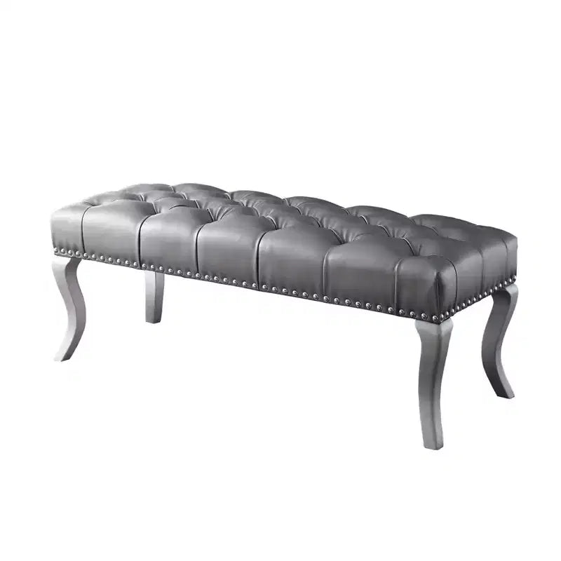 Banc en similicuir capitonné couleur champagne avec garniture cloutée
